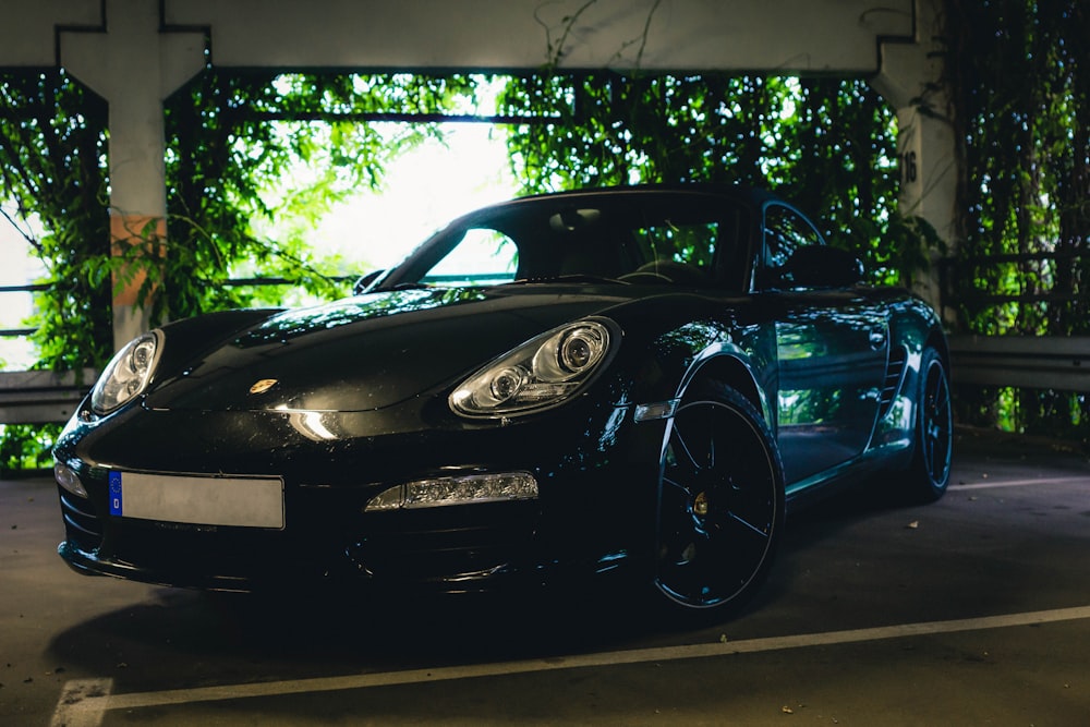 black porsche 911 parked on parking lot during daytime