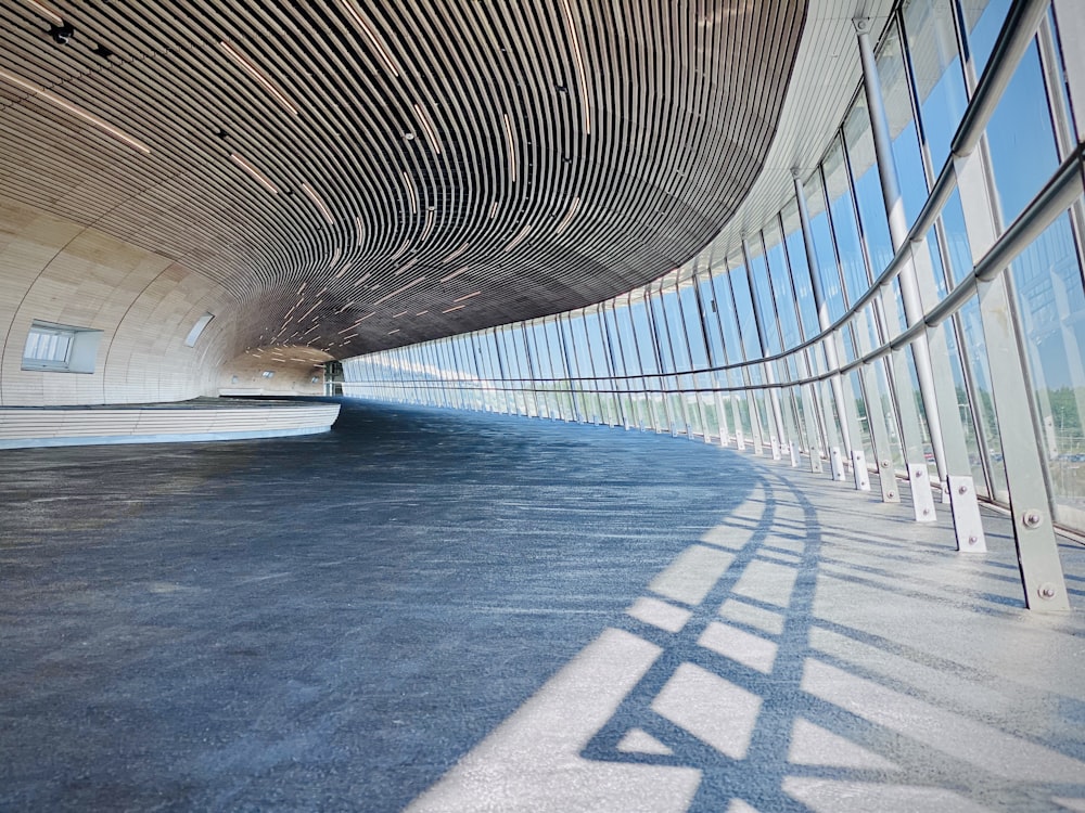 blue and white tunnel with white metal railings