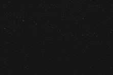 black textile on black background