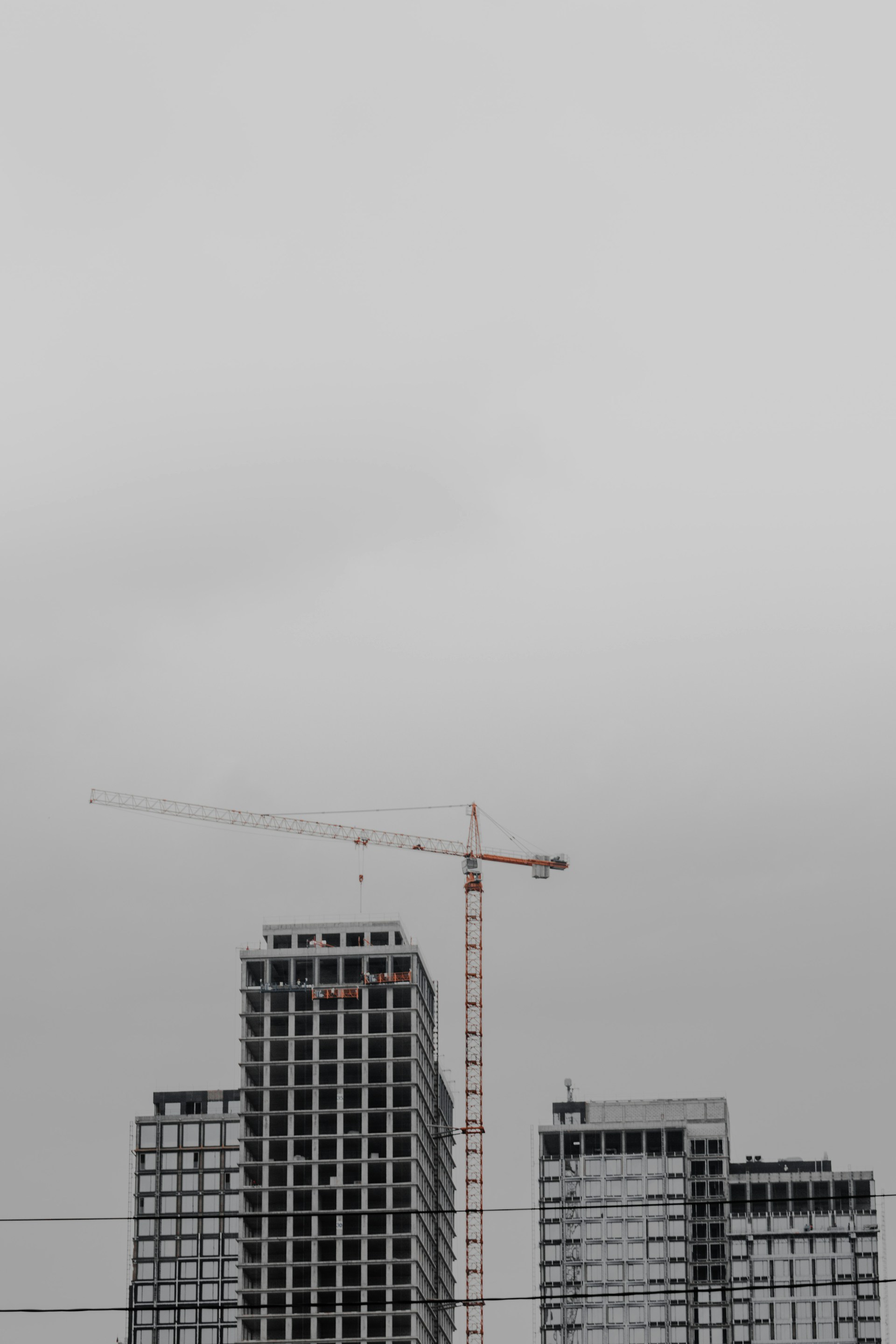 black and white building under white sky