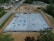 Aerial view of a construction site with a drone in the foreground.