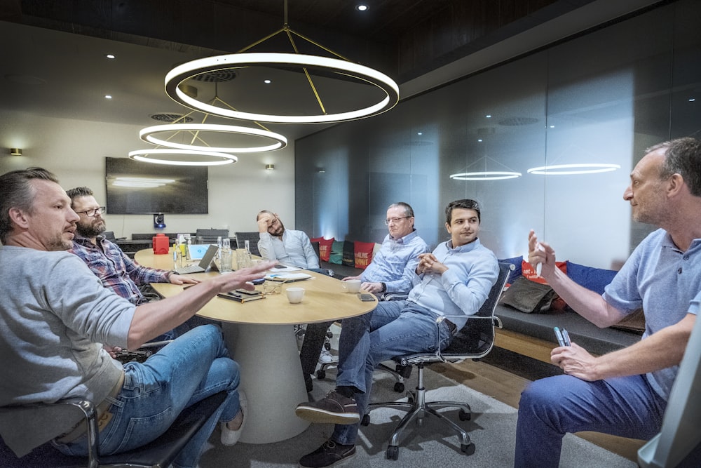 group of people sitting on chair