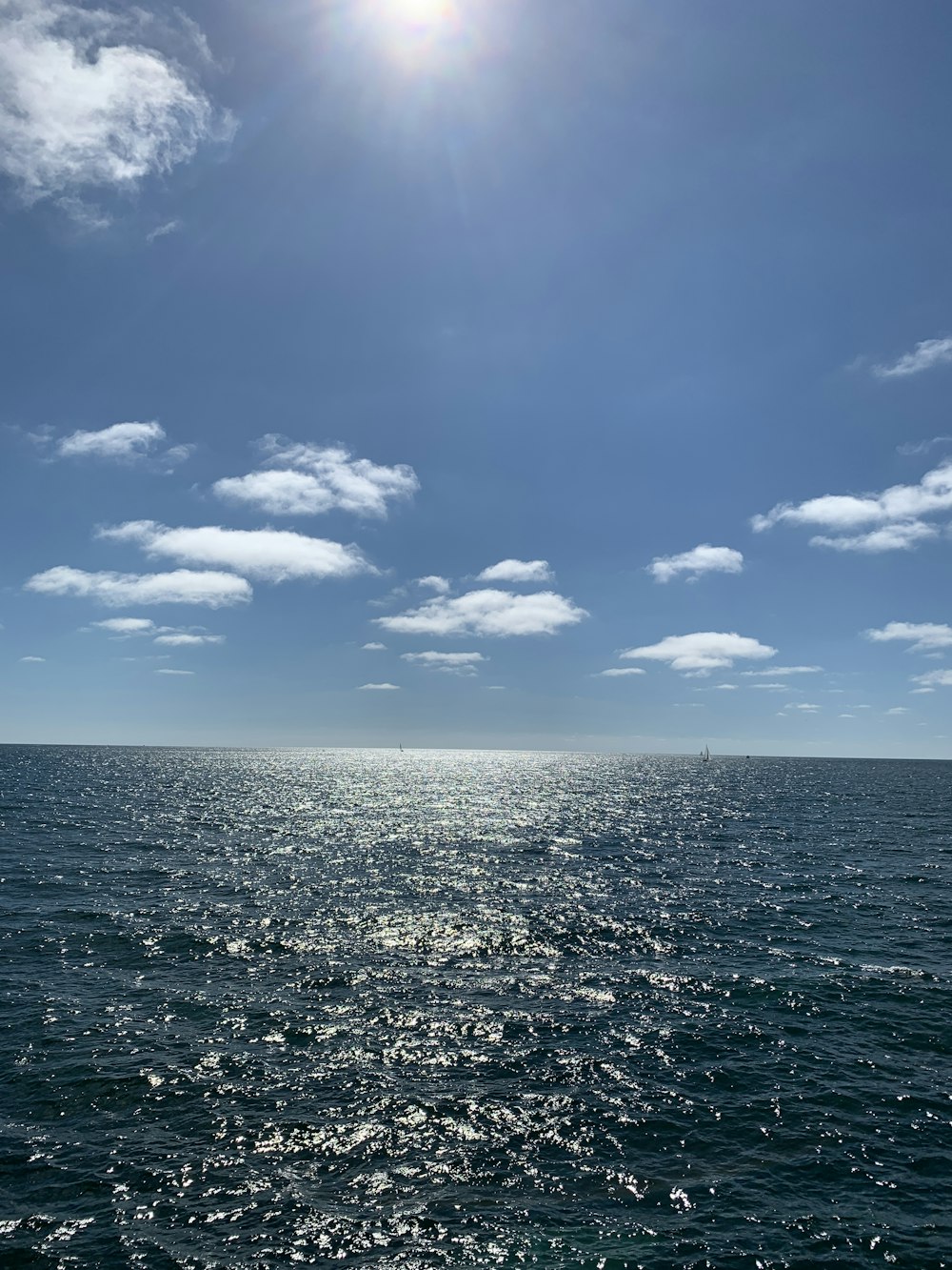 blue sky and white clouds over sea