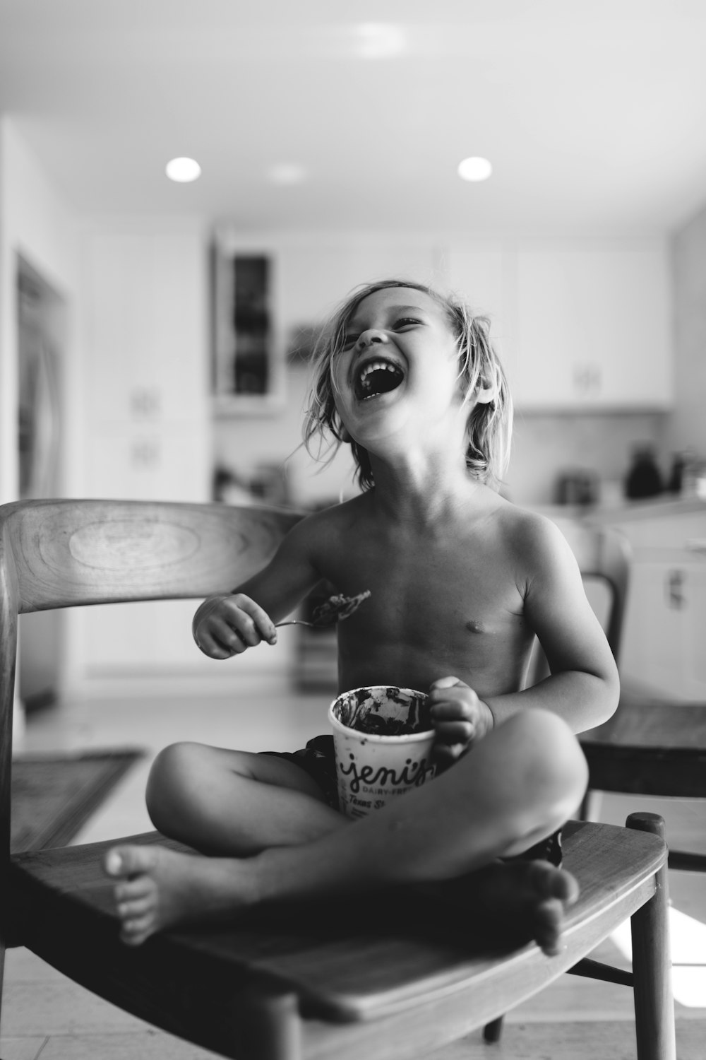 topless woman drinking from a cup