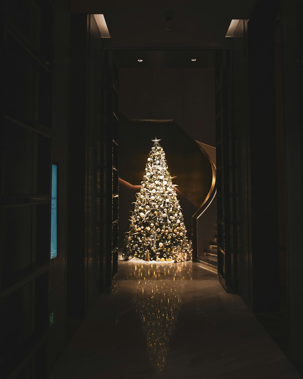 lighted christmas tree in room