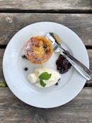 bread with white cream on white ceramic plate