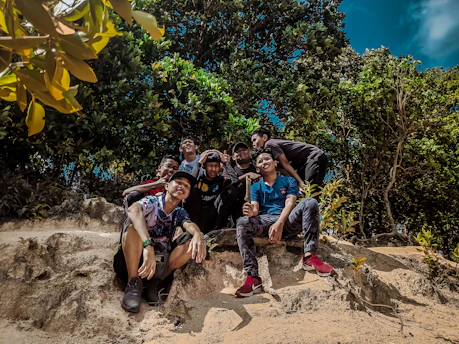 A vibrant group enjoying a team building event outdoors with scenic nature background.