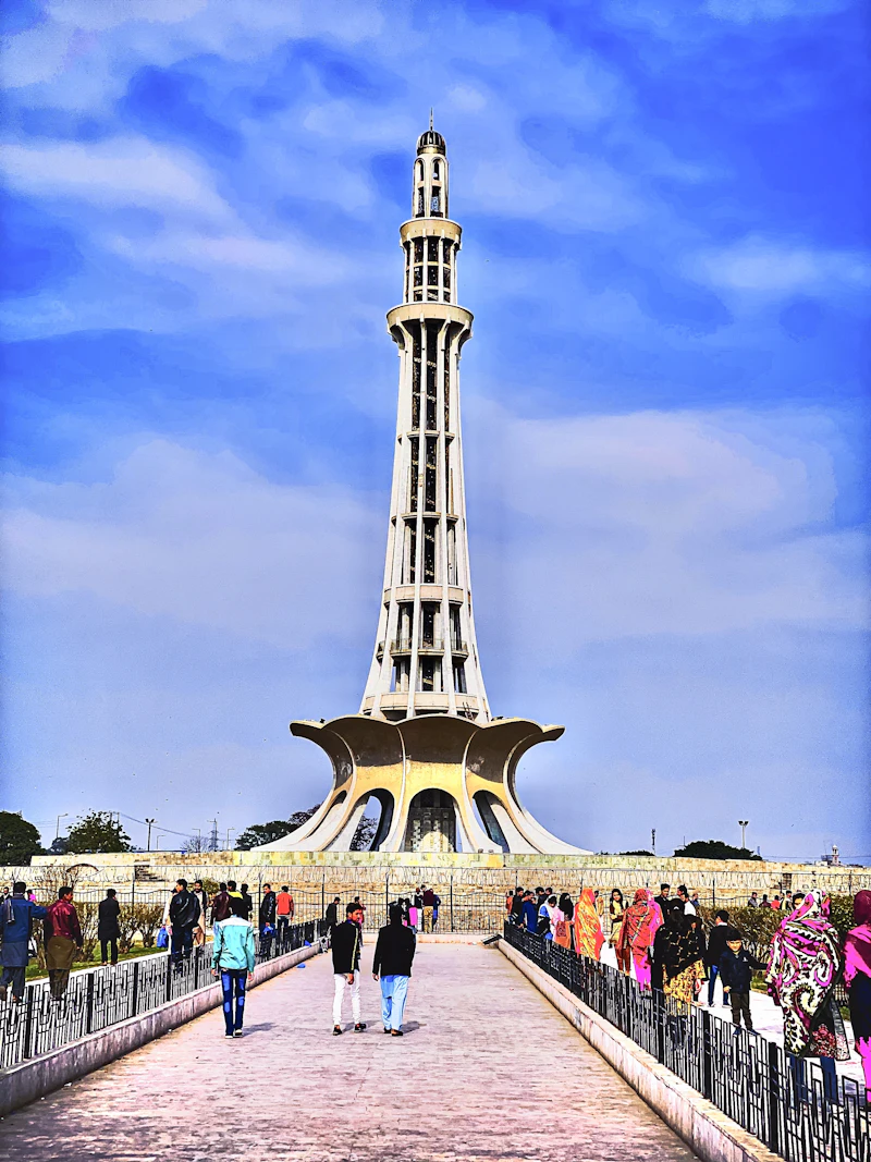 People walking on a busy street in Lahore