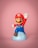 a toy figure of mario on top of a blue object