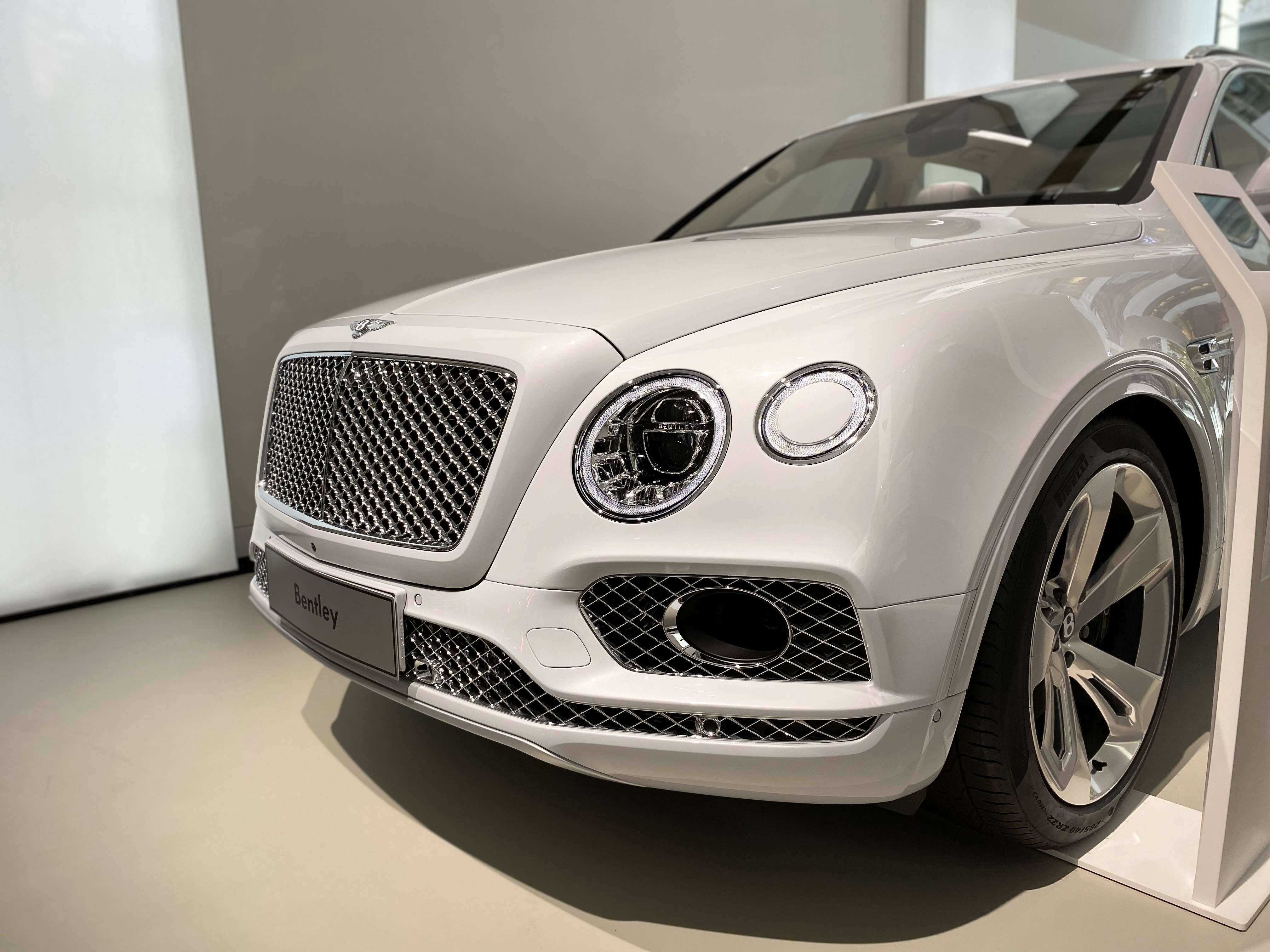 Bentley Flying Spur 2026 in Blue, luxury performance sedan front three-quarter view