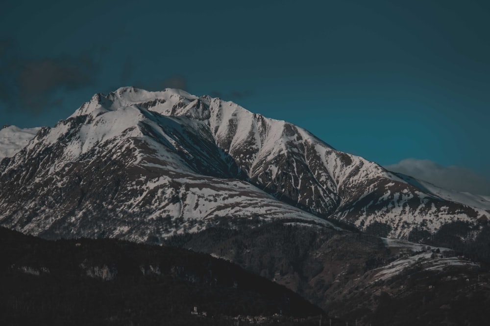 snow covered mountain under blue sky during daytime