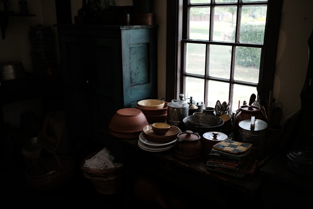 brown wooden table near window