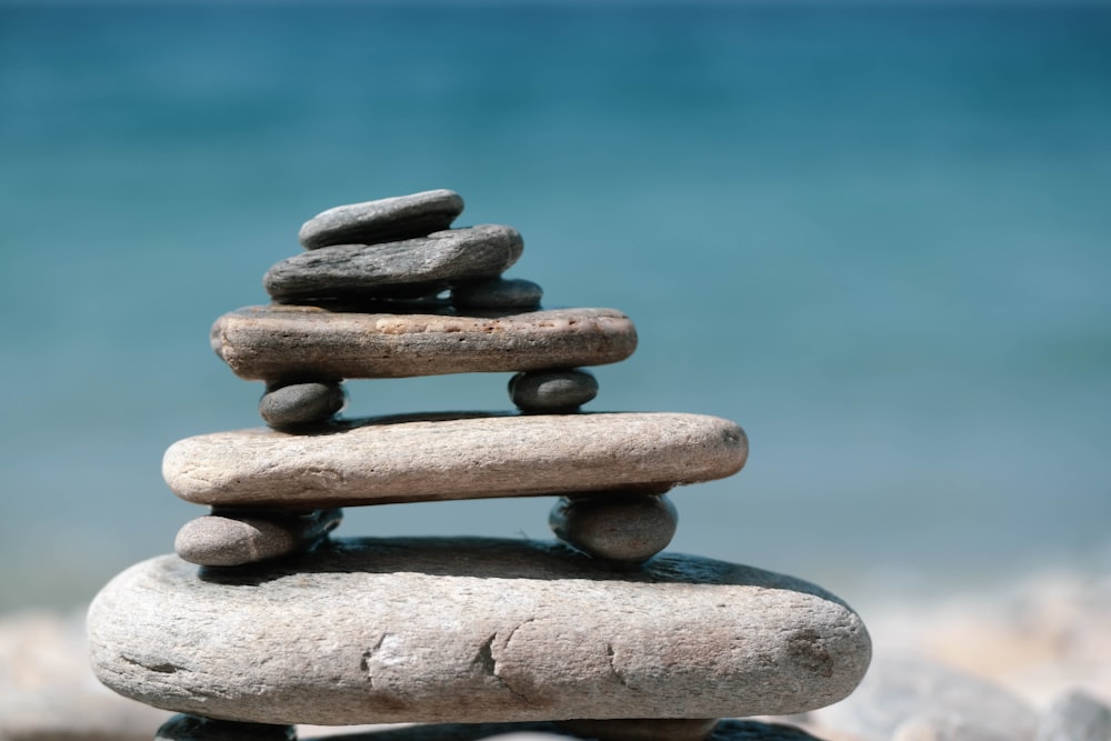 brown stone stack on water