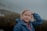 woman in blue jacket smiling