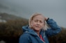 woman in blue jacket smiling