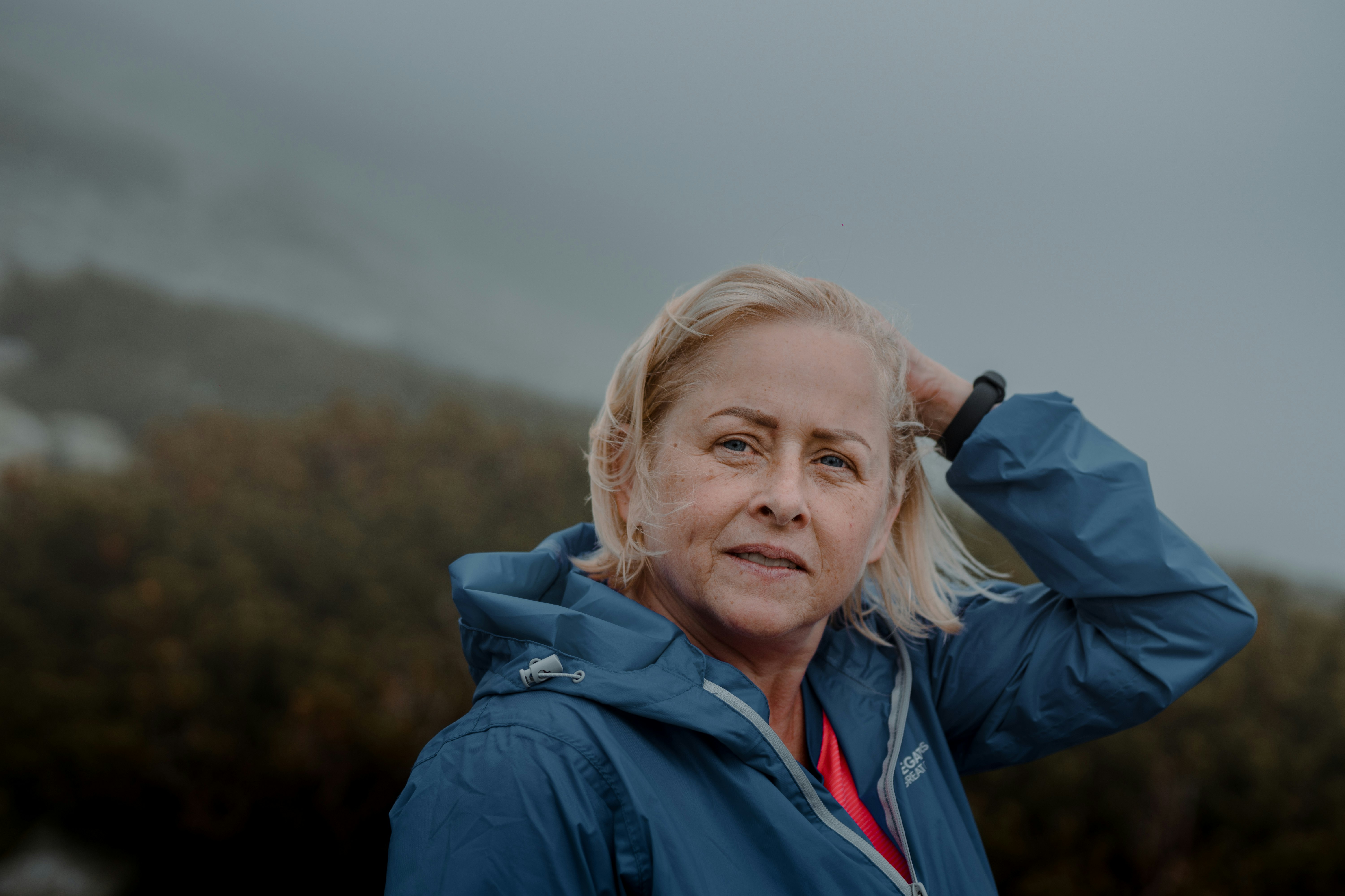 woman in blue jacket smiling