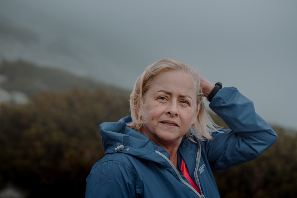 woman in blue jacket smiling