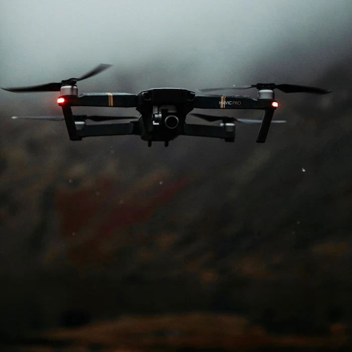 Black and red drone flying