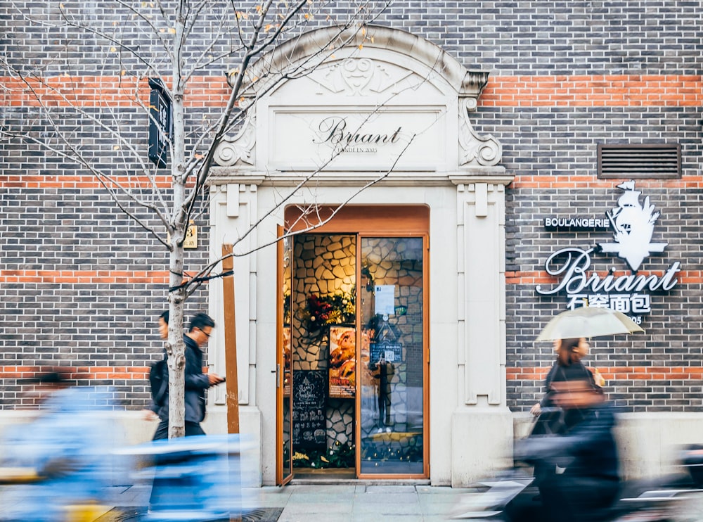 man in black jacket standing in front of store