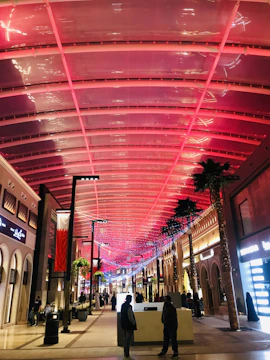 A vibrant street view of Vibo Place bustling with shoppers and tenants.