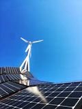 white wind turbine on top of a building
