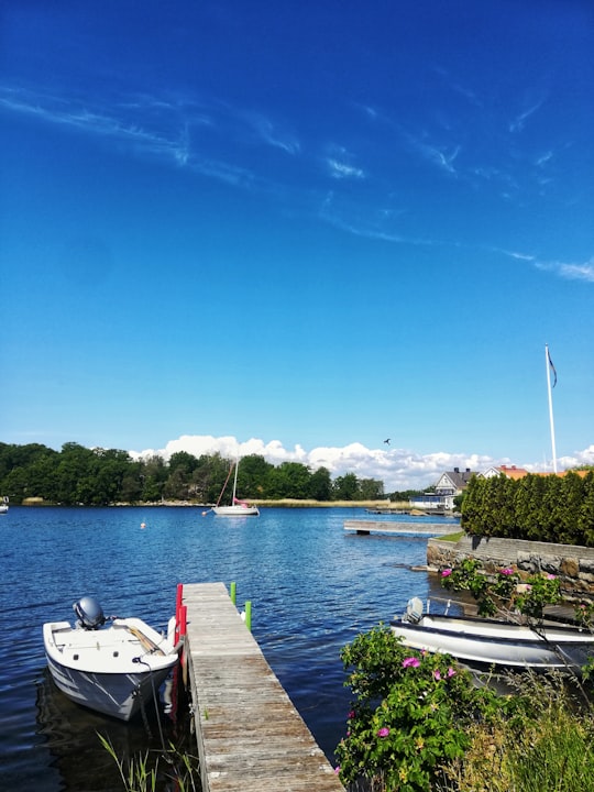 white boat on dock during daytime in Karlskrona Sweden