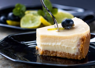 sliced cake on black plate