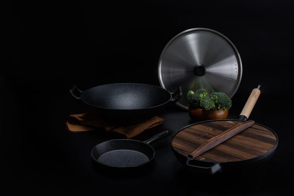 brown wooden handled stainless steel cooking pan