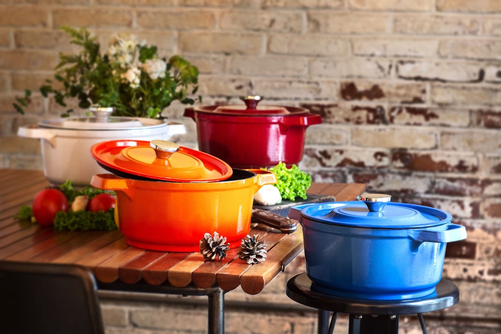 red and blue plastic containers on brown wooden table