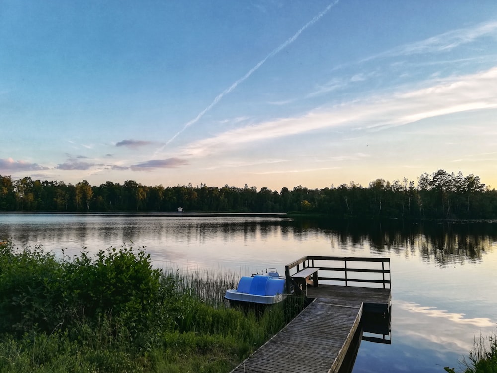 brown wooden dock on lake during daytime