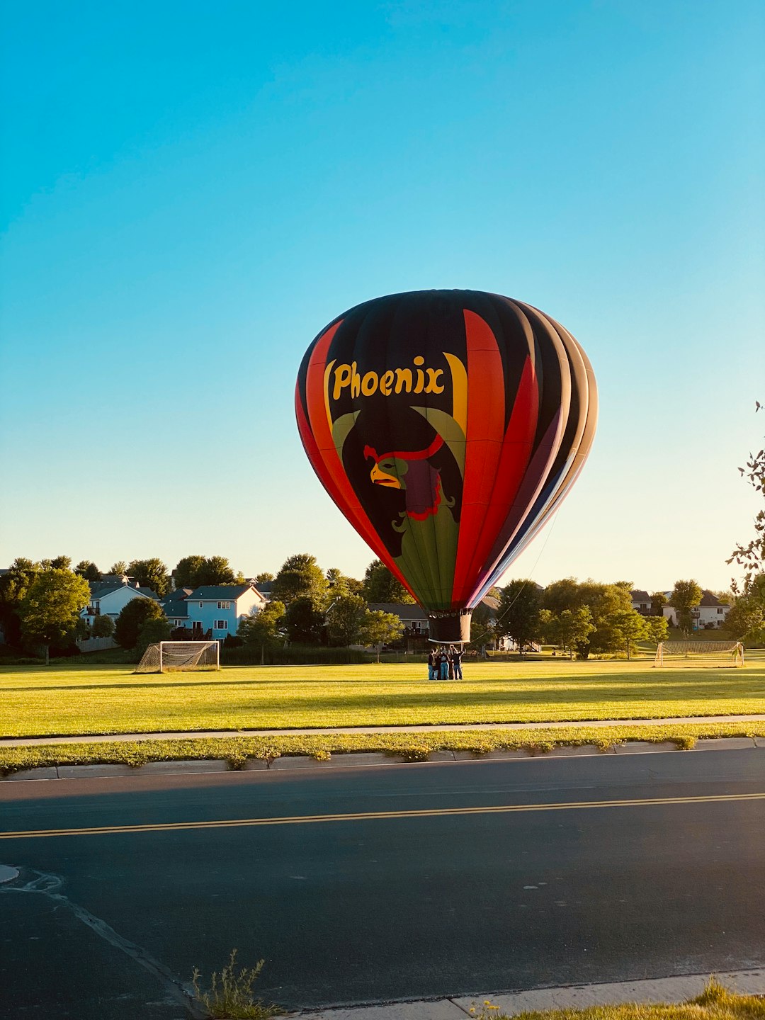 red yellow and blue hot air balloon on mid air during daytime