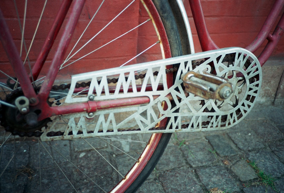 red bicycle with silver wheel