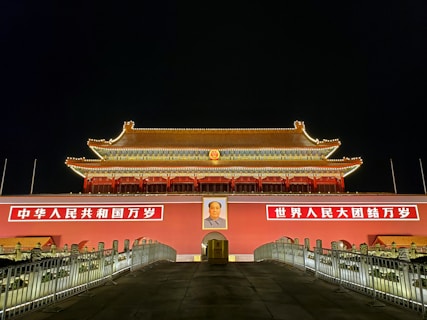red and white concrete building during nighttime