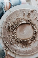 brown powder in white round container