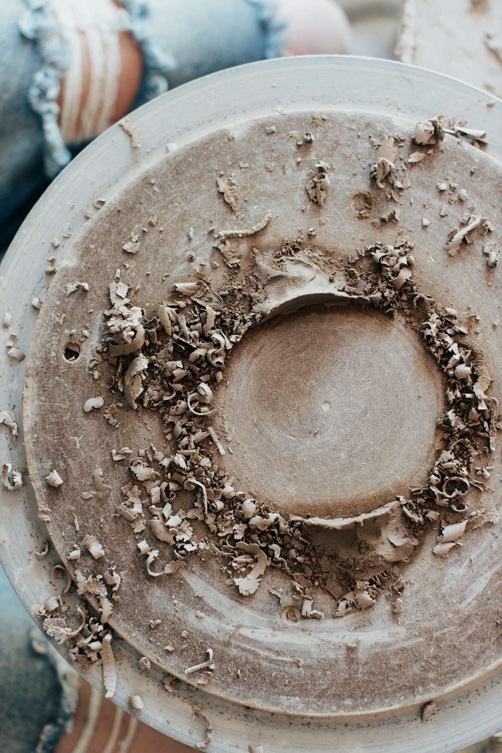 brown powder in white round container