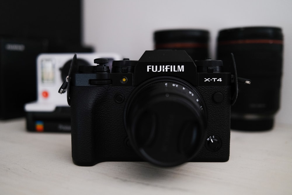 black nikon dslr camera on white table