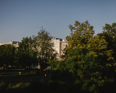 A well-maintained residential building managed by Elty House under clear blue skies.