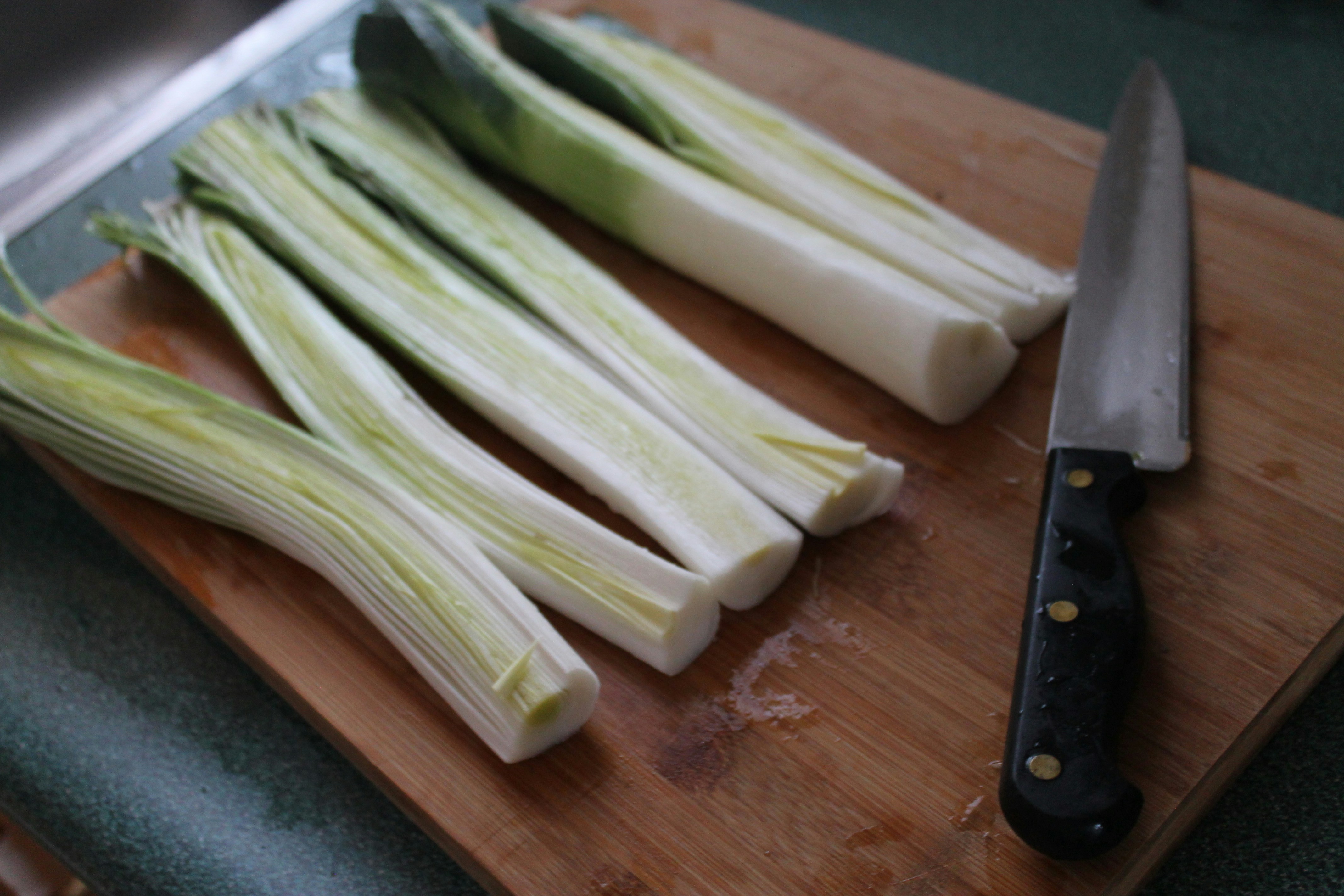 green vegetable on brown wooden chopping board