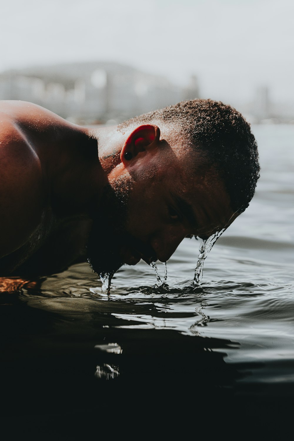 man in water during daytime