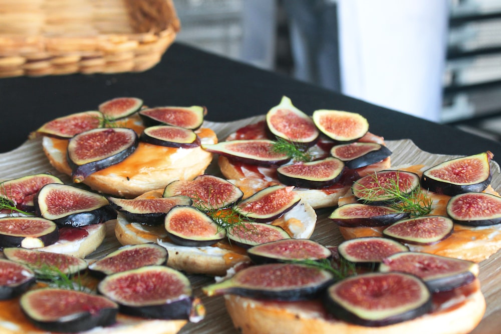 sliced pizza on brown wooden tray