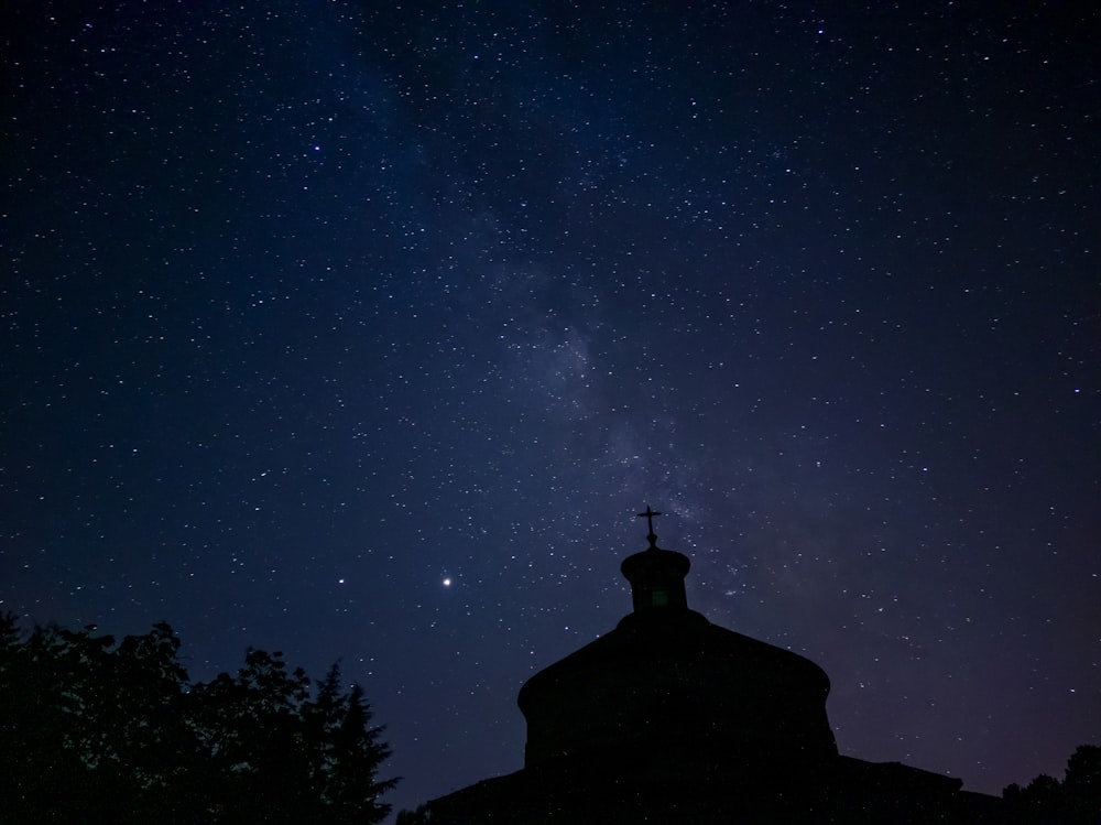 black concrete building under starry night