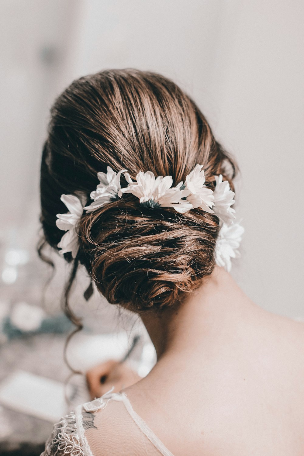 woman with white flower on hair