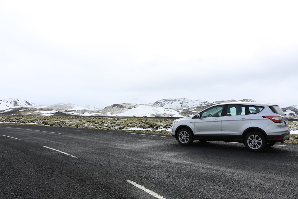 silver suv on road during daytime