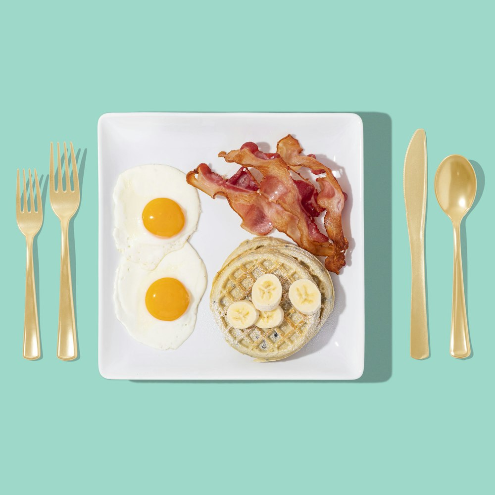 white ceramic plate with food and stainless steel fork