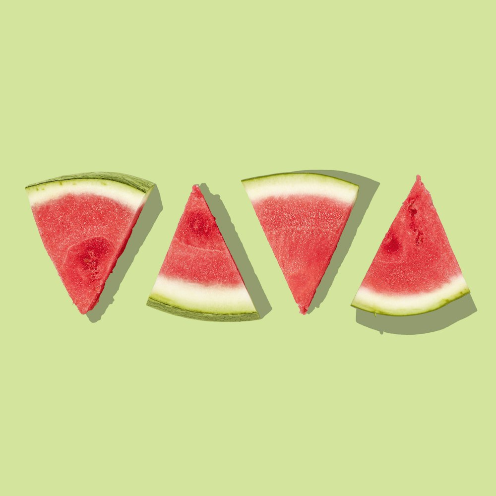 sliced watermelon with green background