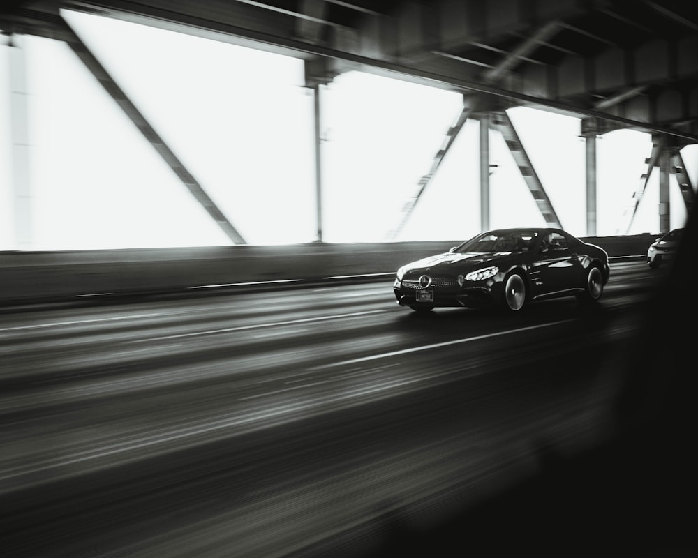 black coupe on a highway