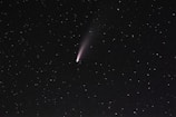 Close-up image of the bright comet 3I/Atlas against a starry background