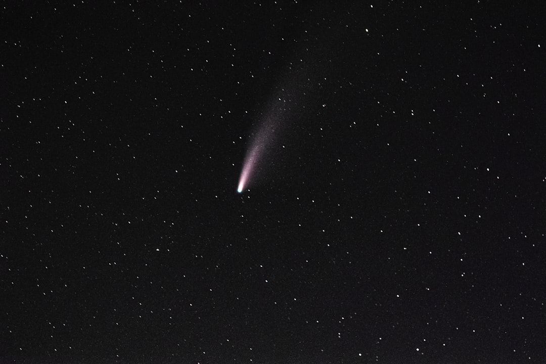 white light in dark night sky