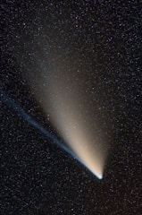 A bright comet streaking across a clear night sky symbolizing innovation and forward momentum.