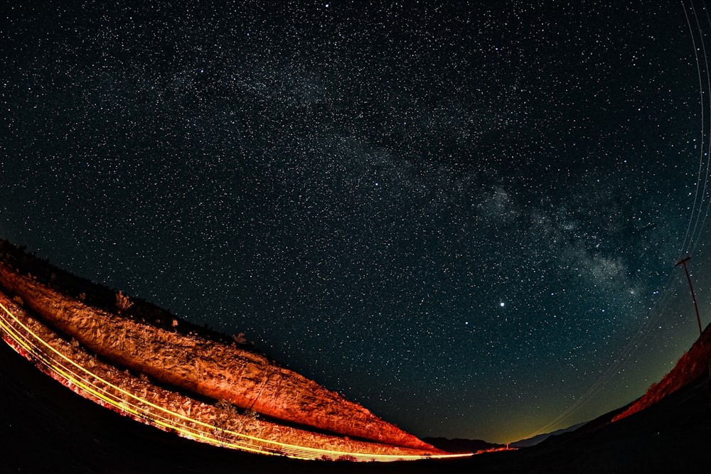 brown mountain under blue sky during night time